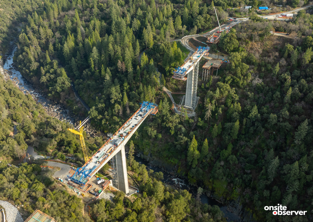 An aerial view shows the Mosquito Road Bridge under construction where work is underway to connect the final sections of the new canyon crossing. Image: Onsite Observer. 