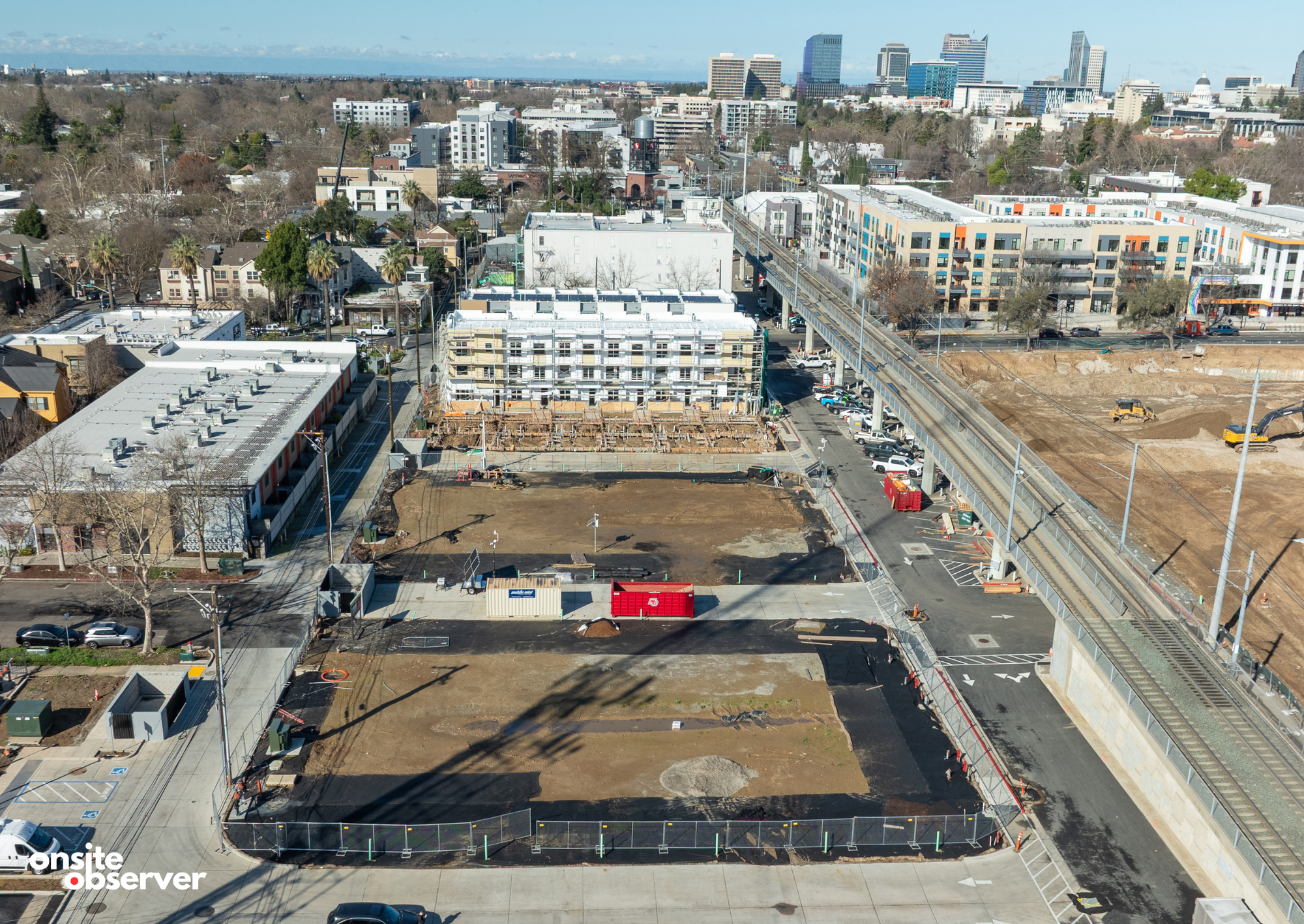 An aerial view shows the R21 townhome site in Midtown Sacramento, where the first completed building fronts 21st Street. Image: Onsite Observer.