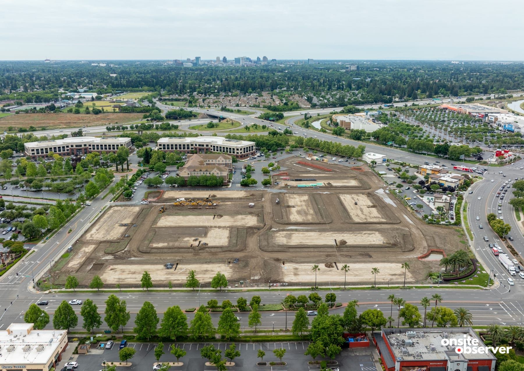 An aerial view shows early site work underway for the planned 378-unit Birchway at Natomas apartment project near Gateway Park Boulevard and North Freeway Boulevard in North Natomas.