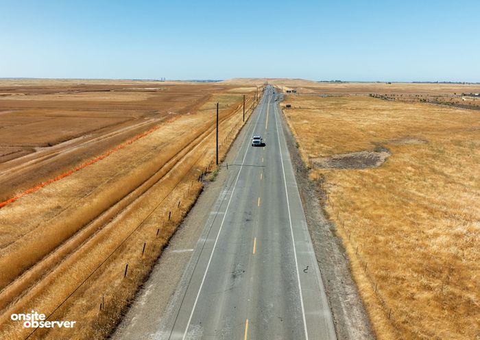 Aerial image of Grant Line Road cutting through open fields in eastern Sacramento County. 