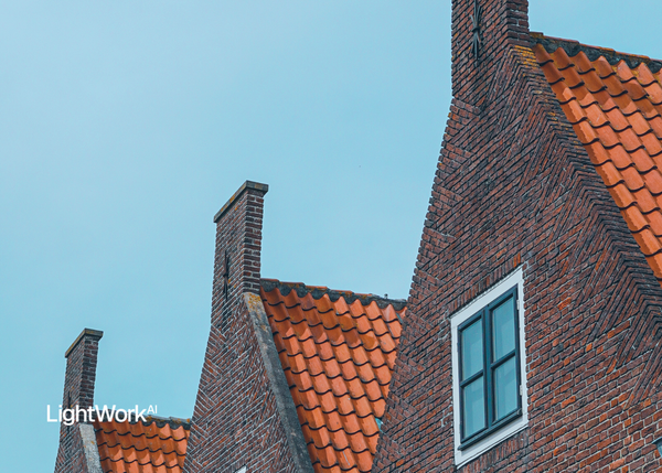 LightWork AI logo with houses in background