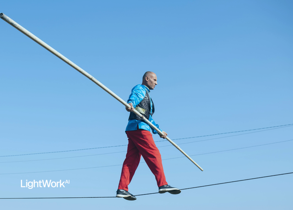 LightWork AI logo and man balancing a stick on a rope