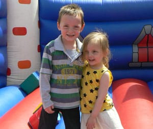 Aiden and Kelsey Cawser on the bouncy castle