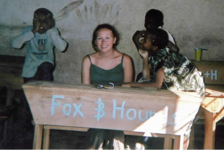 Amy Mullins with the Fox and Hounds desk in Tanzania
