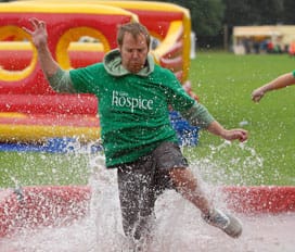 knockout-153_email Jamie Gratton taking part in a wet & wild challenge at last summer’s It’s A Knockout competition for St Giles Hospice