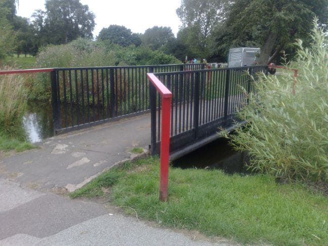 The footbridge over Beacon Pool which will be replaced, and behind it the area where the new Café will be built.