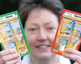 St Giles Hospice Promotions’ Lesley Holmes with the Rainbow Scratchcards
