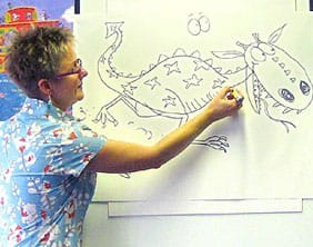 lynnechapman Lynne Chapman drawing a dragon at Lichfield Library