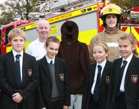 fireworks-maple-hayes Maple Hayes students with firefighters and the mannequin used in the demonstration