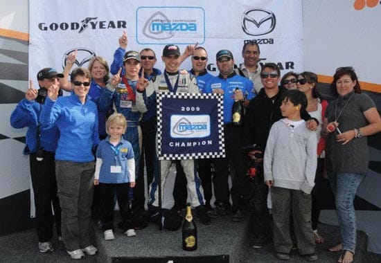 win Adam Christodoulou and the JDC Motorsports Team celebrate the Star Mazda Championship title victory