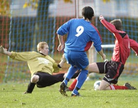 Lichfield City striker John Rob Dutton scores against Enville. Pic: Kevin Grice