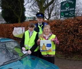 Police Community Support Officer Tim Hughes with pupils Ellie Tooth and Olivia Painter
