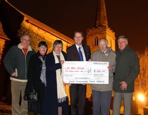 Cllr Matthew Ellis presents the funding cheque