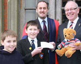  Jack Gayton, James Dance and Dr Daryl Brown present the cheque to Jeremy Hobbs and Hero bear