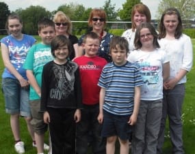 Joshua Hawkins (second from left) with some of the stars and organisers of the DVD