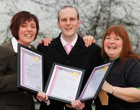 coopworkers Andrea O’Brien, James Caveen and Julia Day with their Service Awards