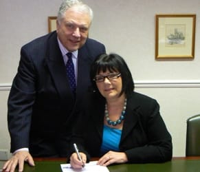 Cllr David Smith and Rose Vakis sign the agreement
