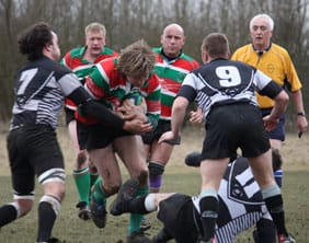 Graham Shelley tries to burst through a tackle