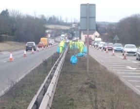 Workers clearing the central reservation on the A5