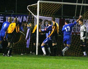 Chasetown bundle the ball home to make it 4-2 against Rushall Olympic. Pic: Dave Birt