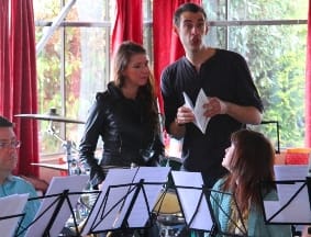 Chris Rolls with actress Rachel Matthews and Amington Band members during rehearsals 