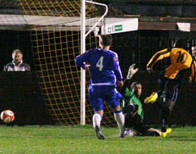 Justin Nisbett scores Rushall Olympic's fourth goal against Chasetown. Pic: Dave Birt