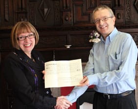 nina-dawes-receiving-the-writ-with-ian-ross-v2 Nina Dawes receives the election writ from the Royal Mail's Ian Ross