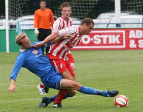 Dave Egan slides in against Romulus. Pic: Dave Birt