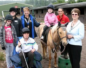 Students Rebecca Long, Nathan Hill, Megan Tomkinson and Klaudia Suchowiak with Maureen Gore from Stafford Lions, trekking centre owner Lisa Gregory and Cllr Liz Staples