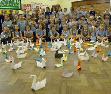 Children from St James Primary School with their origami swans