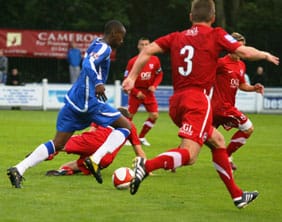 Ramone Stephens runs at the Kidderminster Harriers defence. Pic: Dave Birt
