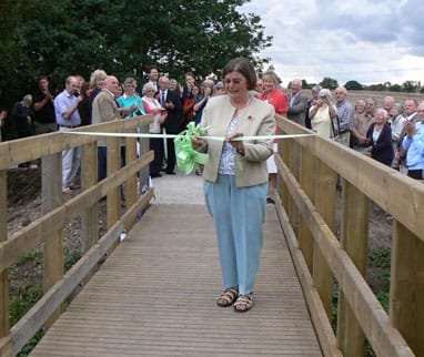 Susan Calder cutting the ribbon on the Calder Crossing bridge