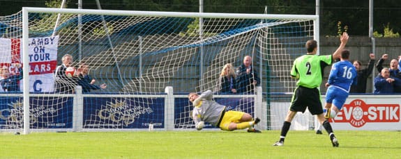 Chasetown FC's Gary Birch tucks scores the equaliser against Halifax Town. Pic: Dave Birt