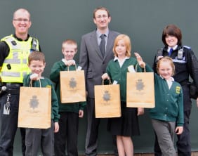 Sgt Richard Morris and PCSO Maggie Griffiths with Charnwood headteacher Simon Kelly and pupils Luke Perry, Daniel Ryan, Laura Bryan and Neve McCallian