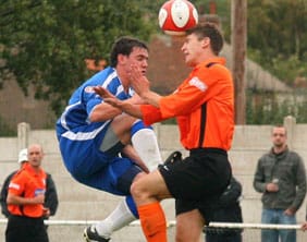 Chasetown's Danny Smith battles for the ball in the air. Pic: Dave Birt