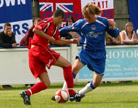 Chasetown FC's Jack Farmer puts in a tackle. Pic: Dave Birt