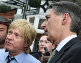 Michael Fabricant and Philip Hammond talk to HS2 protesters outside the Lichfield Guildhall