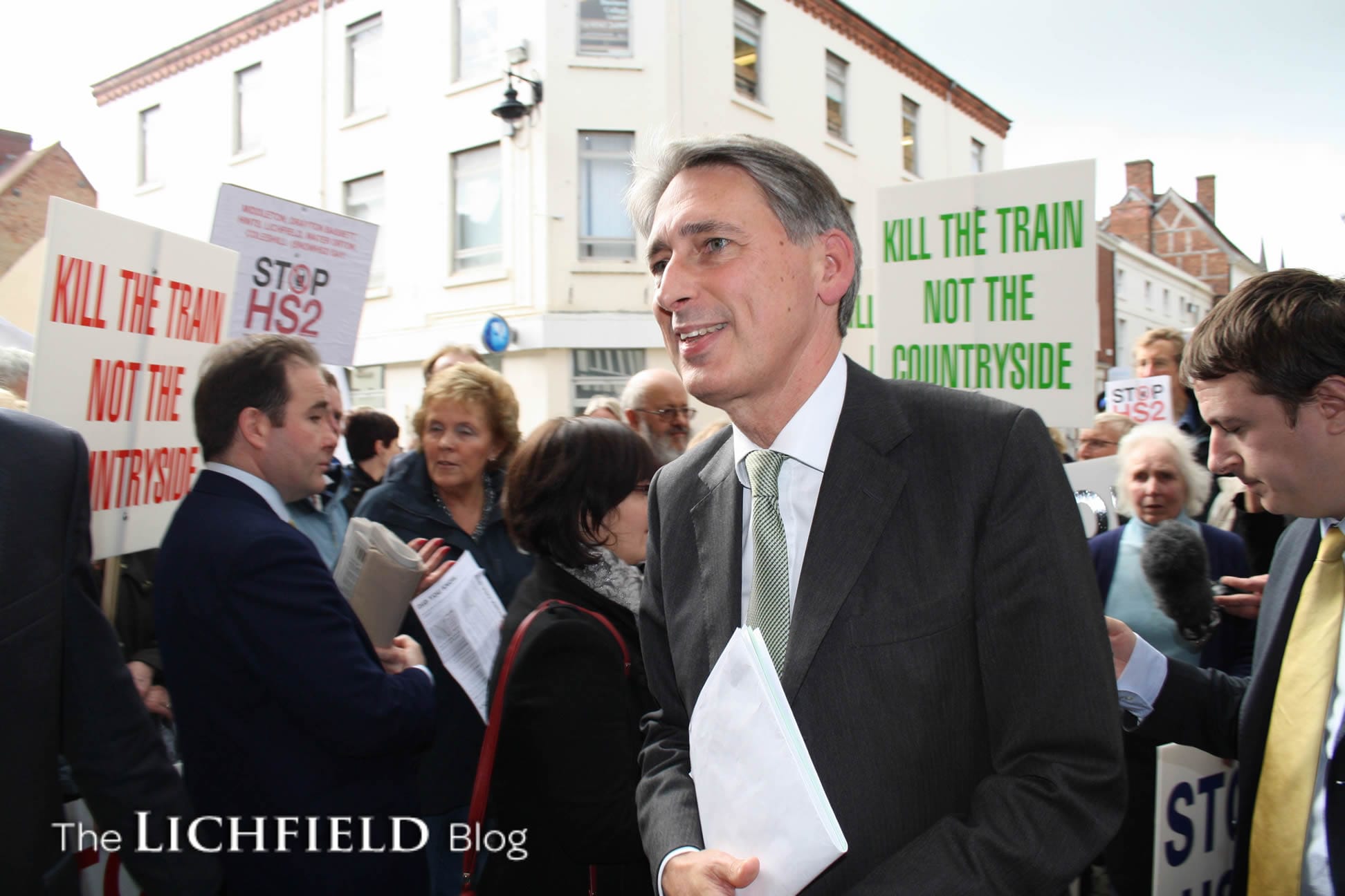Philip Hammond leaves the Guildhall in Lichfield after meeting protesters