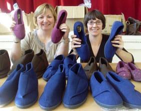 Lucie Broad and Cheryl Rice prepare to run the Sloppy Slippers stand