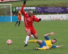 Mark Ward tackles Chasetown's Jimmy Turner. Pic: Dave Birt