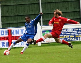 ramone-stephens-at-full-strech Chasetown's Ramone Stephens clears the ball under pressure. Pic: Dave Birt