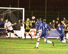 Richard Teesdale volleys home a late equaliser for Chasetown. Pic: Dave Birt