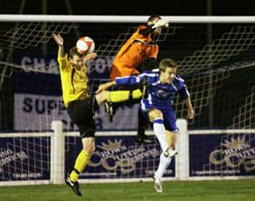 Chasetown goalkeeper Ryan Price attempts to win the ball in the air. Pic: Dave Birt