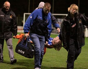 Ben Jevons is stretchered off. Pic: Dave Birt
