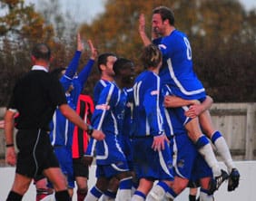 Dave Egan celebrates with his Chasetown team-mates. Pic: Dave Birt