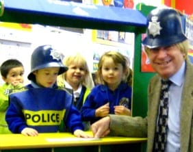 Michael Fabricant having his finger prints taken by Archie Allport, while Xander Webb, Lauren Mace, and Abbie Brown look on
