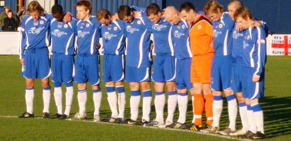 Chasetown's players observe a minute's silence ahead of Remembrance Sunday. Pic: Dave Birt