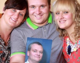 Stephenie, Lewis and Alice Poppitt with a picture of Steve Poppitt