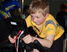 A young competitor tries out the wattbikes