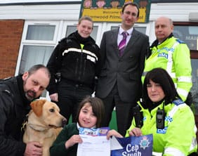 drugdogprize Trinity Turner meets Ben and his handler PC John Maunders, with PC Alison Rowley, headteacher Simon Kelly, PCSO Brian Harbon and PCSO Maggie Griffiths